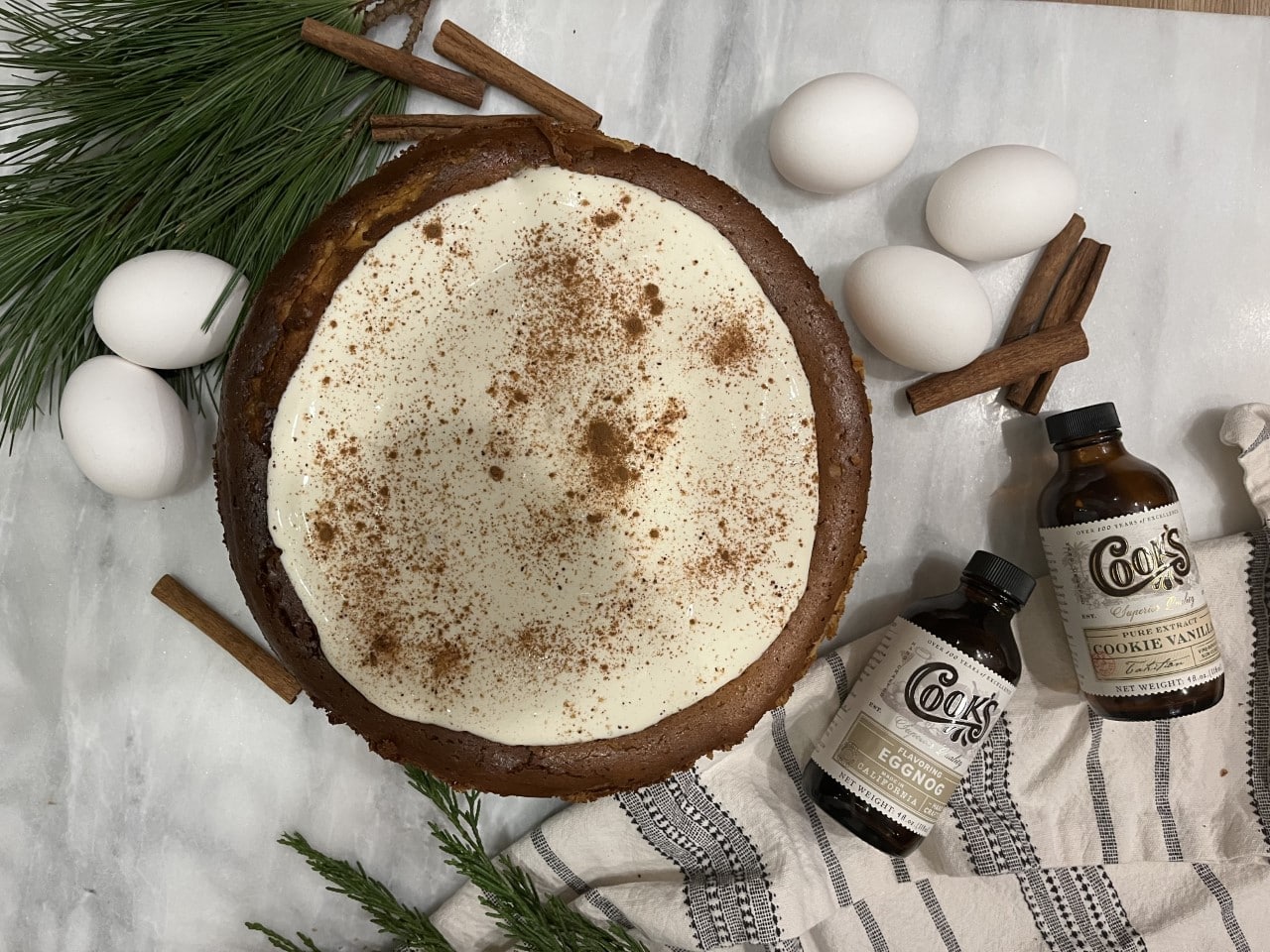 Eggnog Cheesecake with Sour Cream and Rum Topping